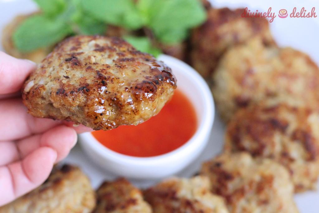 Chinese style meat patties dipped in chilli sauce